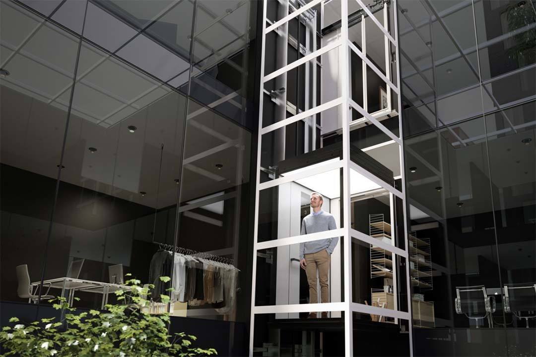 04 Kabinenlift über 4 Etagen in selbsttragendem Liftschacht aus Glaspaneelen Kabinenlift über 4 Etagen in selbsttragendem Liftschacht aus Glaspaneelen